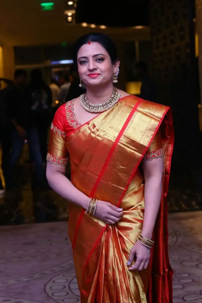 ACTRESS INDRAJA IN ORANGE SAREE AT RAZAKAR MOVIE EVENT 12